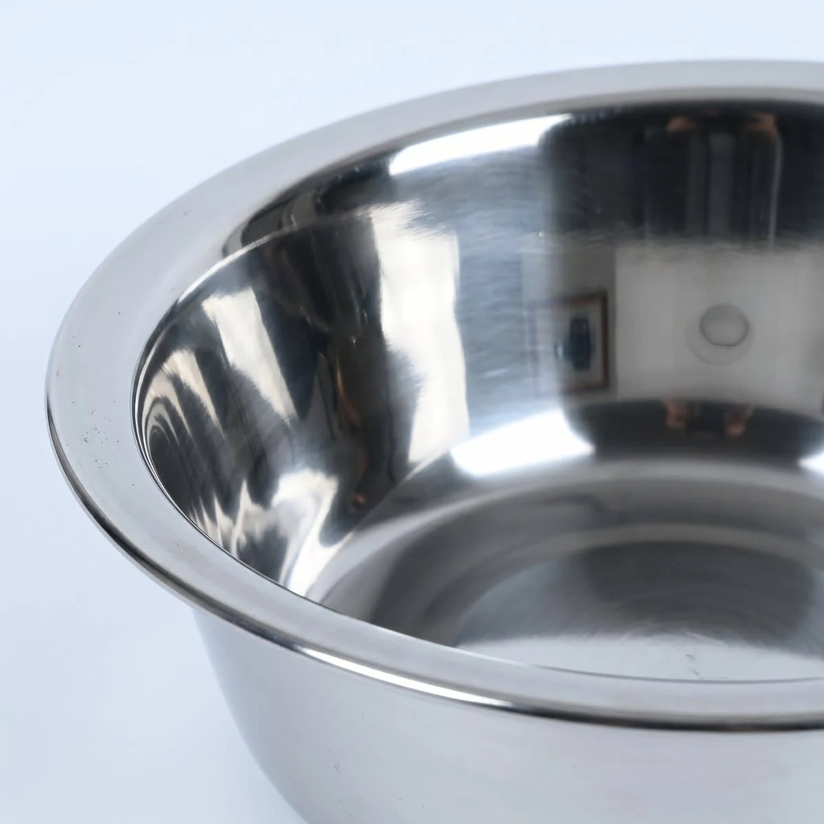 Detail shot of the stainless steel bowl insert, close enough to read the brushed finish.
