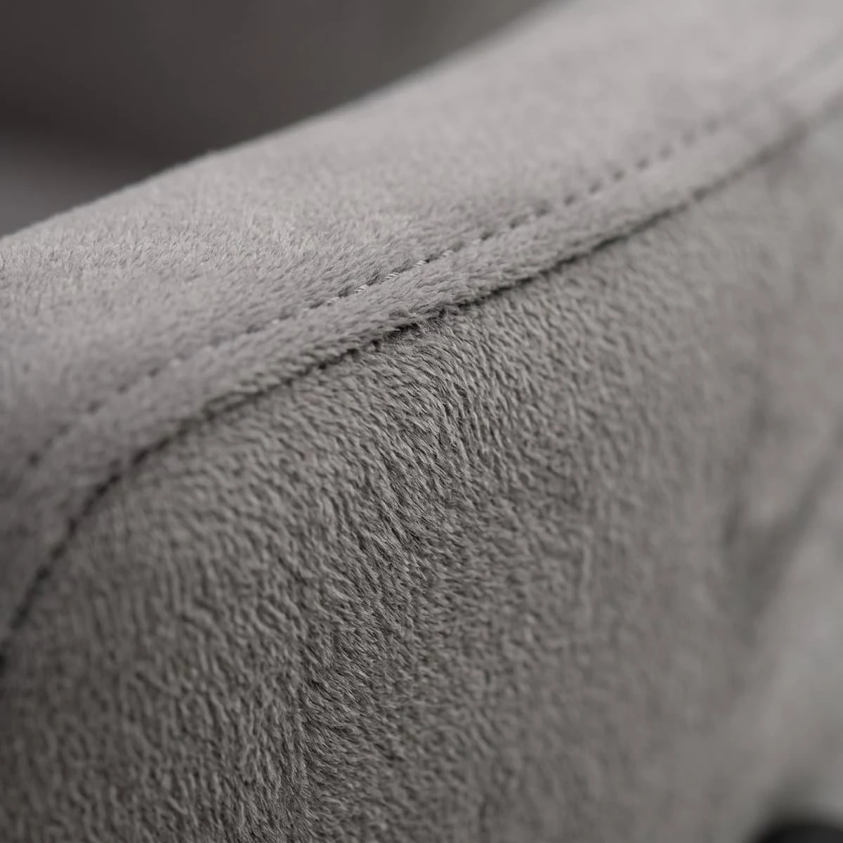 Detail shot of the grey velvet upholstery and stitched seam on the Sambo bed.