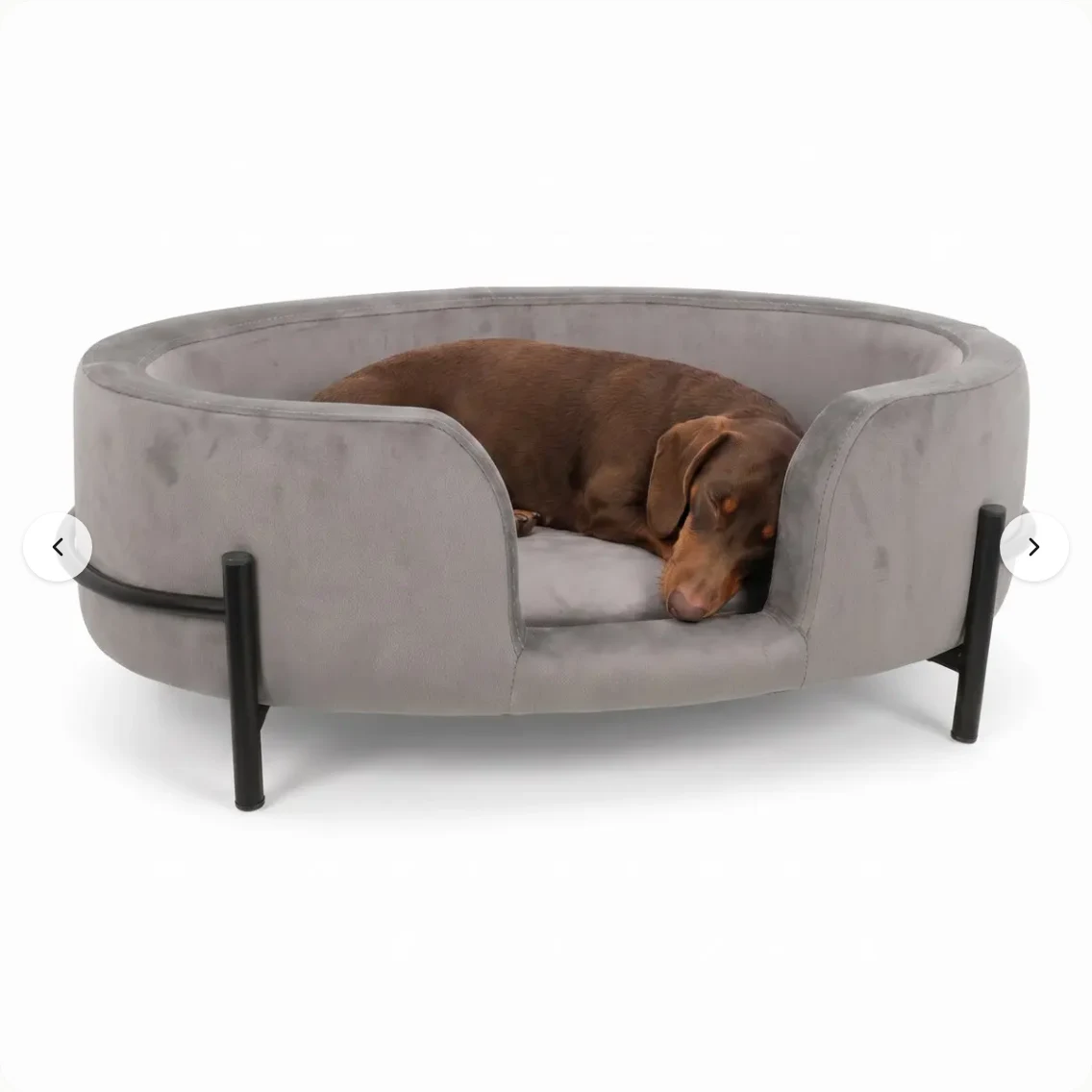 Product photo of the Hondenmand Sambo, a grey velvet dog bed with black metal legs, on a plain white background.