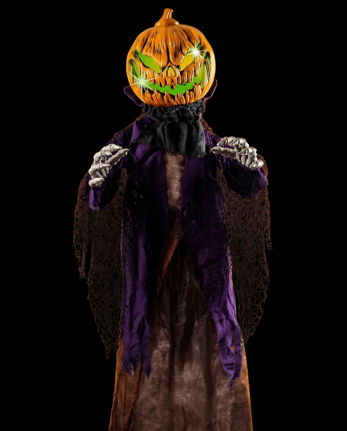 Animatronic prop: a robed figure with a carved, lit pumpkin for a head.